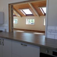 The hatch provides service through from the kitchen to the main hall. View of the hall from the kitchen, through the serving hatch