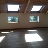 Interior of the village hall is well-lit and looks south across the valley. Interior of the village hall, looking south across the valley.